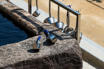 metal ladles at the Buddhist temple