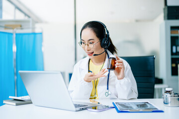Asian female doctor analyzing data on laptop with Gantt chart overlay. Concept of healthcare planning, AI innovation, medical analytics, and real people professionalism.