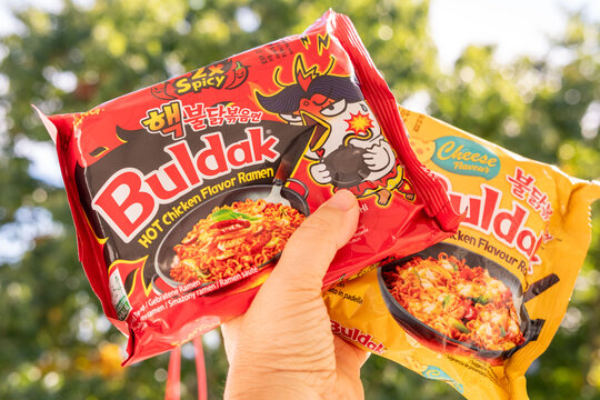 Korean instant ramen, Popular spicy noodle brand Buldak in spicy, cheese and carbonara flavors, global trend popular food product, snack sensation selection, fiery and creamy varieties