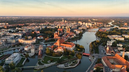 Golden Hour Aerial View of Ostrów Tumski in Wrocław with Gothic Cathedral, Tumski Bridge and Historic Architecture by the Oder River, Poland