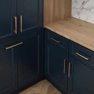 Navy Blue Cabinetry with Wood Open Shelving and Marble Backsplash