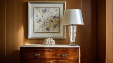 Fototapeta premium Elegant Home Decor with Stylish Lamp and Artistic Print on Wooden Drawer Cabinet