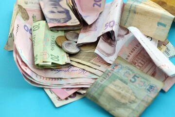 Big amount of different Ukrainian hryvnia money bills. Pile of crumpled ukrainian banknotes