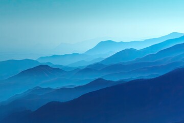 Vast mountain range, soft blue hues