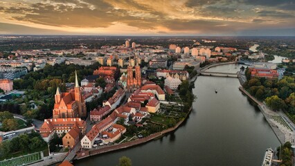 Golden Hour Aerial View of Ostrów Tumski in Wrocław with Gothic Cathedral, Tumski Bridge and Historic Architecture by the Oder River, Poland
