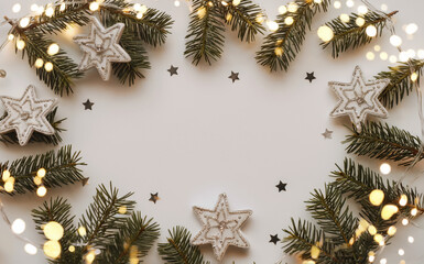 Christmas Decoration Flat Lay Featuring White Star Ornaments, Evergreen Branches, Warm String Lights, and Black Confetti, Festive Holiday Border Design with Blank Center for Seasonal Greeting Cards.