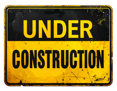 A weathered sign displaying the phrase "UNDER CONSTRUCTION" in bold black letters on a bright yellow background, indicating ongoing work or development.
