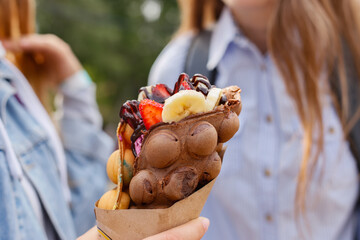 Sweet bubble waffle dessert with fresh fruits