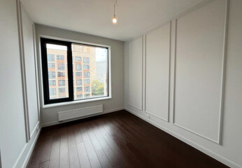 Sun-kissed empty room with urban vista, a blank canvas for Diwali reflections or Scandinavian minimalist dreams, whispers serenity