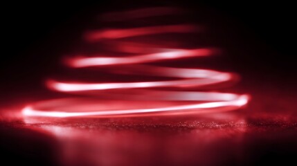 Abstract red spiral light trail creating a dynamic sense of motion and energy against a dark textured background