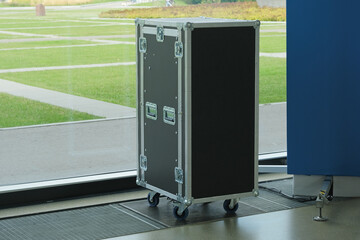 Large hard case with professional equipment. Flight Case or Protective equipment box for stage gear transport. Safety cargo container. Transportation and storage