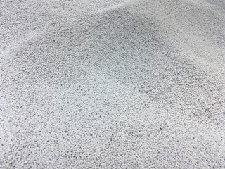 Virgin polyethylene terephthalate pellets. Solid-state polymerized (SSP) PET granules. Granulated plastic polymer for production of plastic utensils and other products