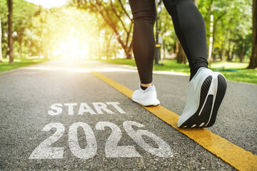 New Year 2026 concept. The beginning of success. The text 2026 written on the asphalt road and a...