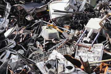 Scrap metal junkyard. Pile of metallic waste and garbage. Industrial recycling process of discarded...