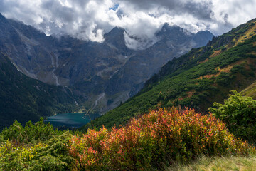Autumn view of Morskie Oko surrounded by the mountain peaks of the High Tatras.