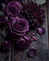 Dark purple flowers still life with petals on rustic wooden background
