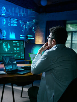 Specialist analyzing futuristic logistics dashboard with holographic global maps. Concept of technology, digitalization, data analytics, AI workflows, and cybersecurity monitoring. Collage
