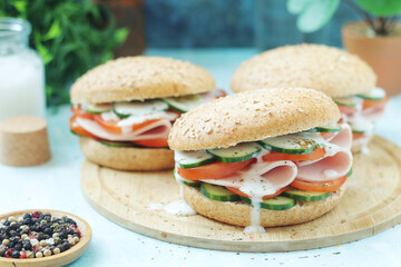 Bun sandwiches with salami and vegetables