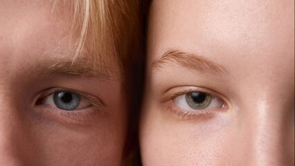Extreme close up of male and female eyes with natural skin and clear detail. Concept of dermatology...