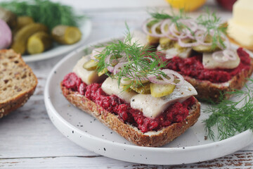 Scandinavian sandwiches with herring and beetroot