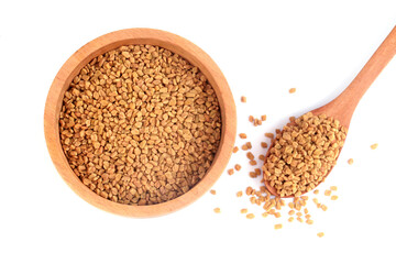 Fenugreek seeds in wooden bowl on white background