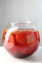 Tasty fruity punch on white table. Refreshing drink