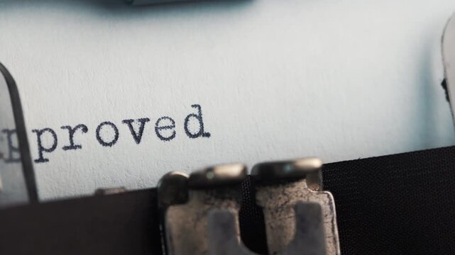 Inscription APPROVED on vintage typewriter