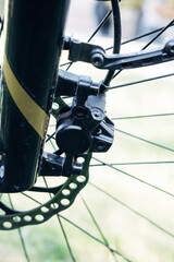 Fototapeta premium Front fork of bicycle with disc brake, detail of modern bike technology