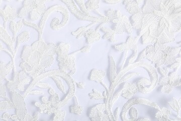 Beautiful lace fabric on white background, closeup
