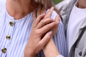 Fototapeta premium Mother and her son, closeup. Family bonding