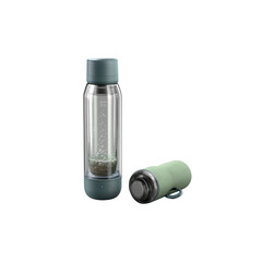 Sleek modern portable infuser bottle with herbal tea brewing in clear glass, perfect for healthy hydration on the go