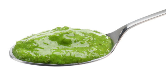 Fresh pesto sauce in spoon isolated on white