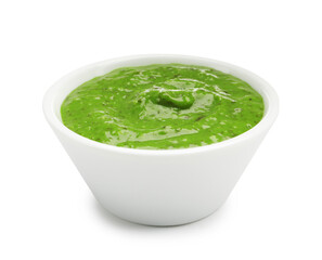 Fresh pesto sauce in bowl isolated on white