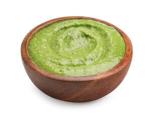 Fresh pesto sauce in bowl isolated on white