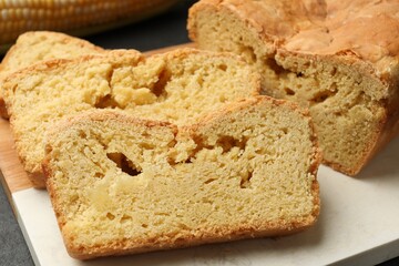 Pieces of freshly baked cornbread on table, closeup