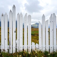 White picket fence in a field