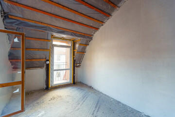 Fototapeta premium Room with window and view of water. Room in new building for fine finishing. Attic.