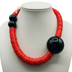 Chunky red necklace with black accents isolated on transparent background
