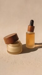 Two elegant skincare products with wooden caps and a dropper bottle, bathed in warm sunlight on a minimalist surface.