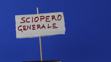 GENERAL STRIKE written on a ticket as a poster and blue background.