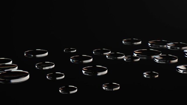 Abstract glass 3d round shapes mooving on a black background. Seamless looping video. 4k abstract motion graphics dynamic futuristic design