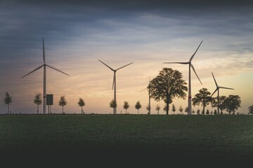 wind turbines at sunset