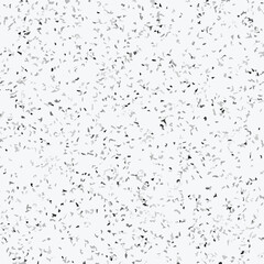 Abstract terrazzo seamless pattern with scattered stone chips in gray and black tones on white background texture.