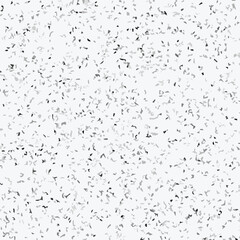 Abstract terrazzo seamless pattern with scattered stone chips in gray and black tones on white background texture.