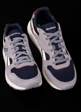 Nis, Serbia - 10 May 2025. Modern reebok classic canvas sneakers on a black background. Reebok GL 1000 unisex lifestyle sneakers. Running shoes. Close up.	

