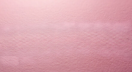 Fototapeta premium A minimalist close-up of a soft, textured light pink surface, creating a gentle and abstract background.