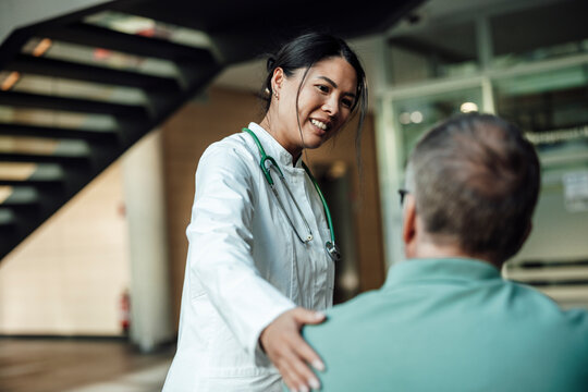 Doctor supports patient during consultation in clinic setting