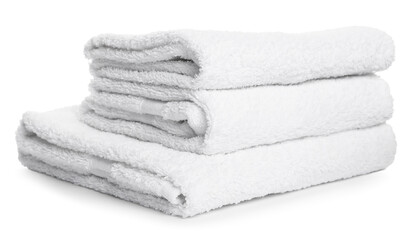 Stack of folded terry towels isolated on white