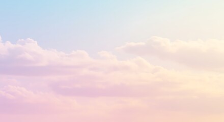 Obraz premium Pastel sky with soft clouds in shades of pink blue and yellow creating a dreamy and ethereal atmosphere