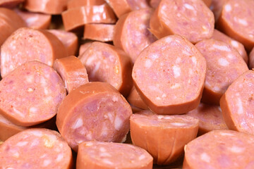 closeup of cut raw pepperoni sausages